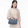 Bolso bandolera convertible doble de denim acolchado