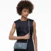 Bolso bandolera convertible The Snapshot de denim acolchado