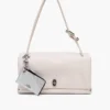 Cartera con cremallera superior y charm recubierta de purpurina para el día a día