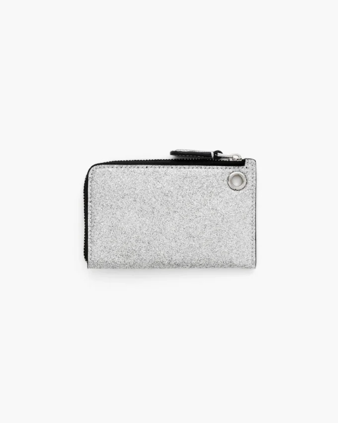 Cartera con cremallera superior y charm recubierta de purpurina para el día a día