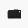 Cartera con cremallera superior y charms
