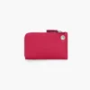 Cartera con cremallera superior y charms Cartera con cremallera superior y charms