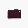 Cartera con cremallera superior y charms