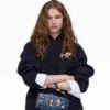El bolso mini dual de denim con charms El bolso mini dual de denim con charms
