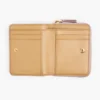 La mini cartera compacta de piel