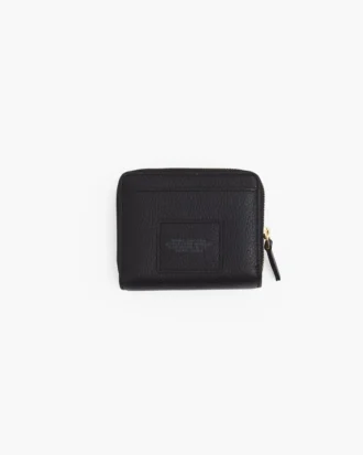 La mini cartera compacta de piel